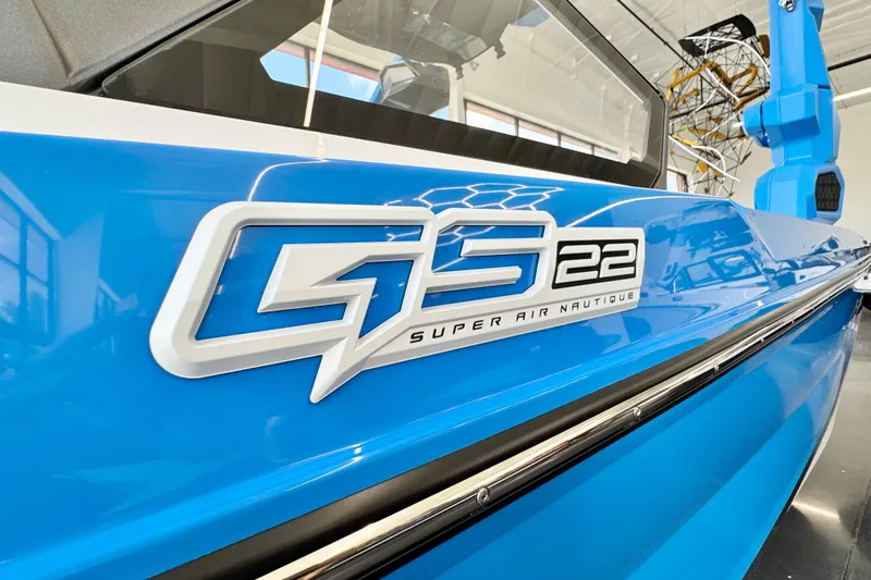 Slide: The Image of 2026 Nautique Super Air Nautique GS22 boat, blue exterior with GS22 logo. - 3