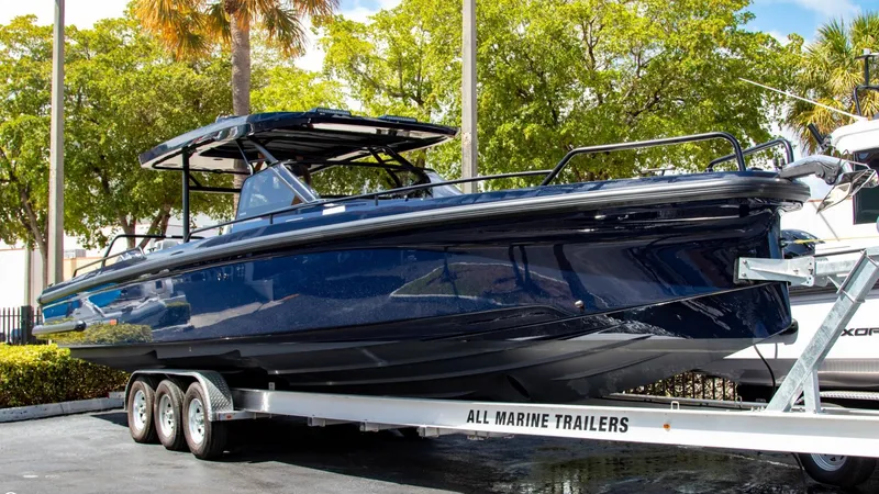 Slide: The Image of 2023 BRABUS Shadow 900 ST boat on All Marine Trailers under sunny skies. - 1