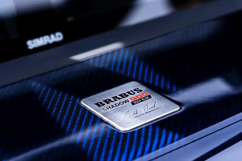 Slide: The Image of Close-up of 2023 BRABUS Shadow 900 ST nameplate on carbon fiber surface. - 15