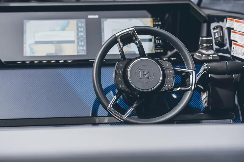 Slide: The Image of 2023 BRABUS Shadow 900 ST steering wheel and dashboard with digital displays. - 16