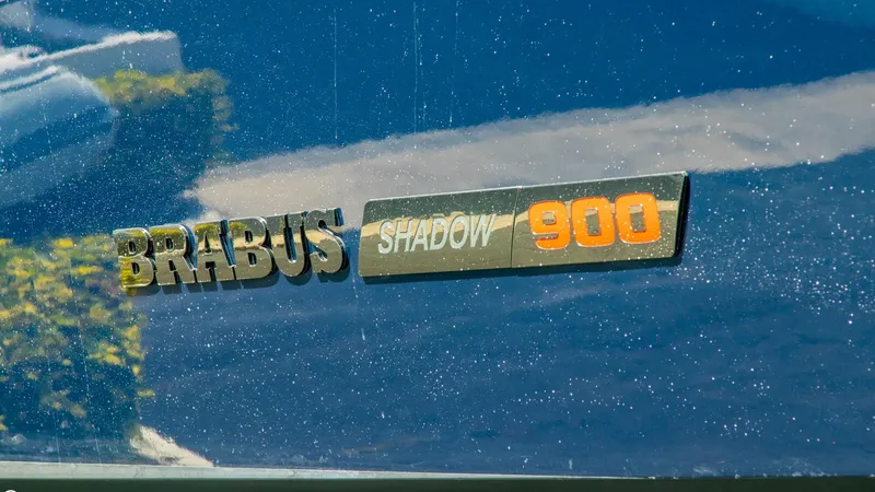 Slide: The Image of BRABUS Shadow 900 ST 2023 logo on a reflective surface. - 19