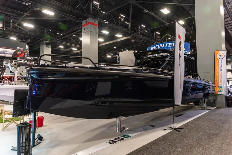 Slide: The Image of 2023 BRABUS Shadow 900 ST luxury boat displayed at an indoor exhibition. - 6