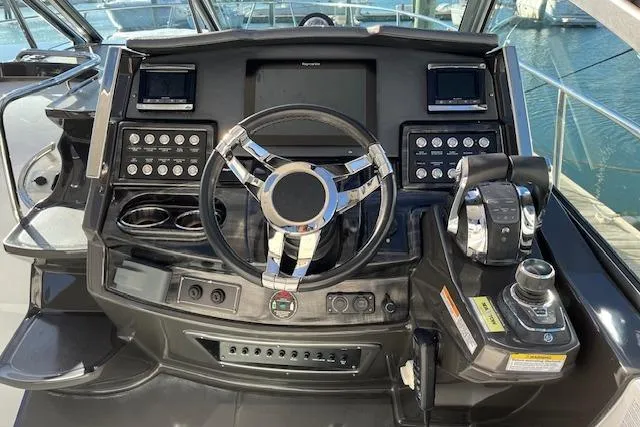 Slide: The Image of Cockpit of 2019 Monterey 355 Sport Yacht with modern steering and controls. - 10