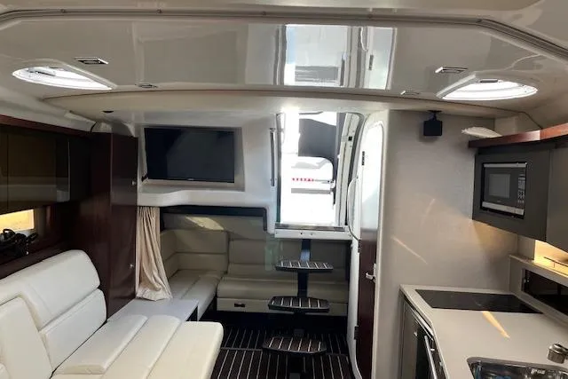 Slide: The Image of Interior of 2019 Monterey 355 Sport Yacht with modern amenities and sleek design. - 15