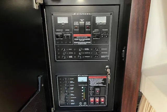 Slide: The Image of Electrical control panel inside a 2019 Monterey 355 Sport Yacht. - 18