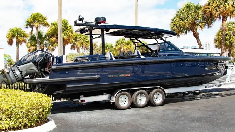 The Image of 2023 BRABUS Shadow 900 ST boat on a trailer, surrounded by palm trees. - 0
