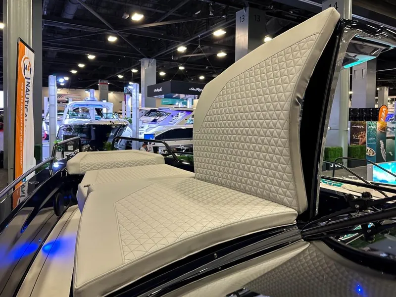 Slide: The Image of 2023 BRABUS Shadow 900 ST luxury boat interior with quilted seating at a boat show. - 12