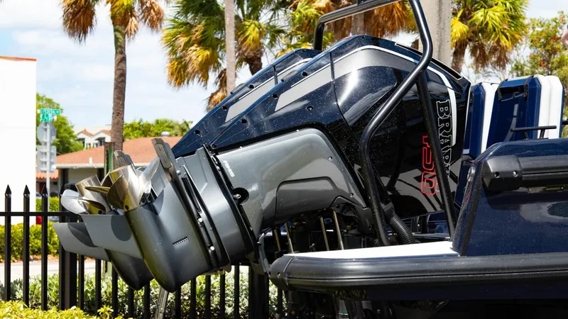 Slide: The Image of 2023 BRABUS Shadow 900 ST outboard motor close-up with palm trees in the background. - 5
