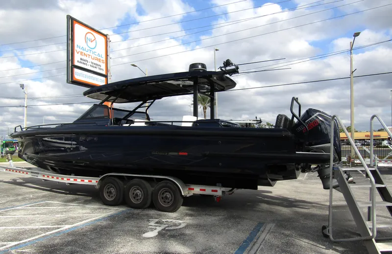 Slide: The Image of 2024 BRABUS Shadow 900 ST boat on trailer at dealership. - 1