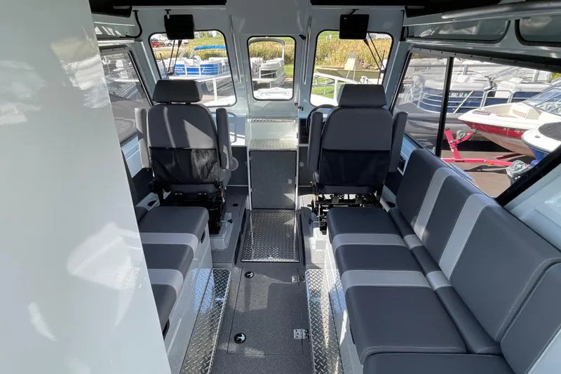 Slide: The Image of Interior of 2026 Hewescraft 270 Alaskan ET HT boat with modern seating and spacious layout. - 19