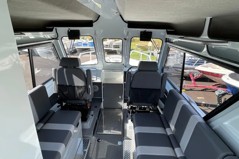 Slide: The Image of Interior of 2026 Hewescraft 270 Alaskan ET HT boat, featuring spacious seating and modern design. - 21
