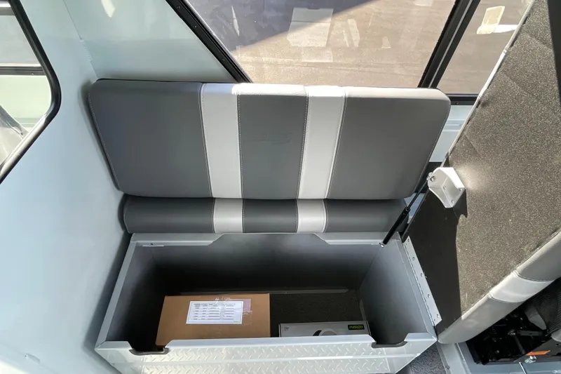 Slide: The Image of 2026 Hewescraft 270 ALASKAN ET HT boat seat with under-seat storage compartment. - 27