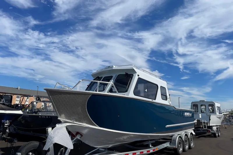 Slide: The Image of 2026 Hewescraft 270 Alaskan ET HT boat on trailer under blue sky. - 3
