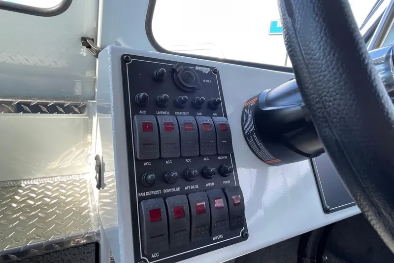 Slide: The Image of Control panel of 2026 Hewescraft 270 ALASKAN ET HT boat with steering wheel. - 37