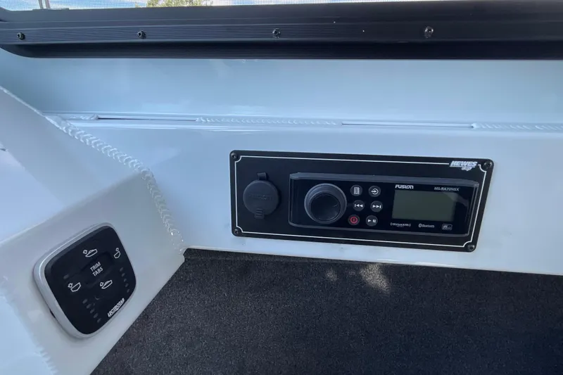 Slide: The Image of Control panel of 2026 Hewescraft 270 Alaskan ET HT boat with Fusion audio system. - 38