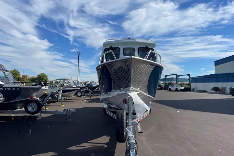 Slide: The Image of 2026 Hewescraft 270 Alaskan ET HT boat on trailer under blue sky. - 4