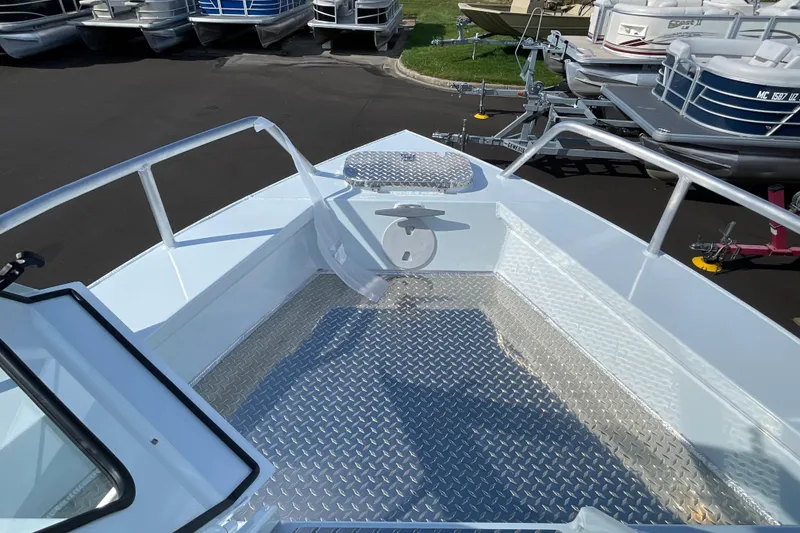 Slide: The Image of 2026 Hewescraft 270 Alaskan ET HT boat deck with diamond plate flooring. - 40