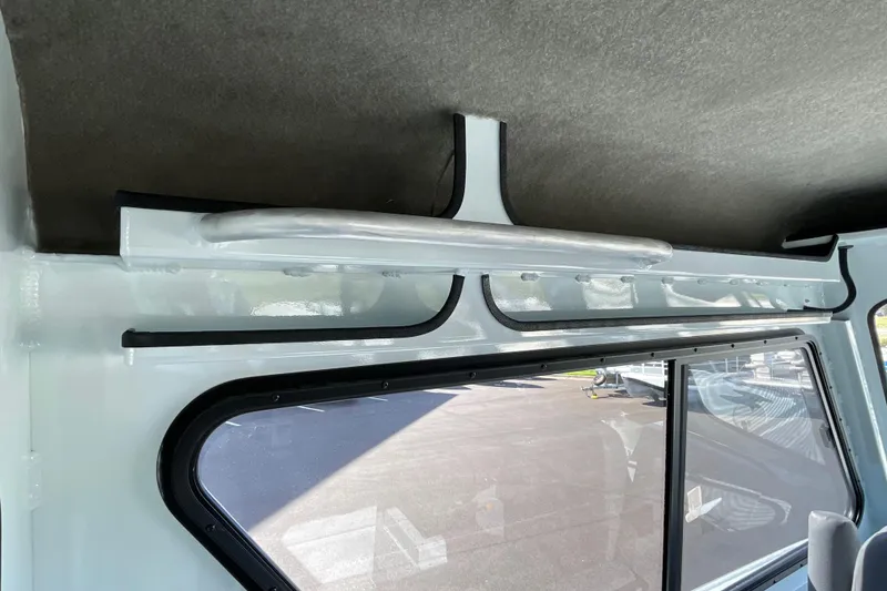 Slide: The Image of Interior view of 2026 Hewescraft 270 Alaskan ET HT boat, showcasing window and ceiling design. - 41