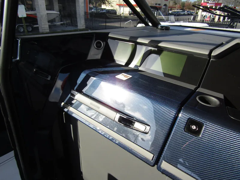 Slide: The Image of 2024 BRABUS Shadow 900 ST dashboard with sleek, modern design and carbon fiber accents. - 16