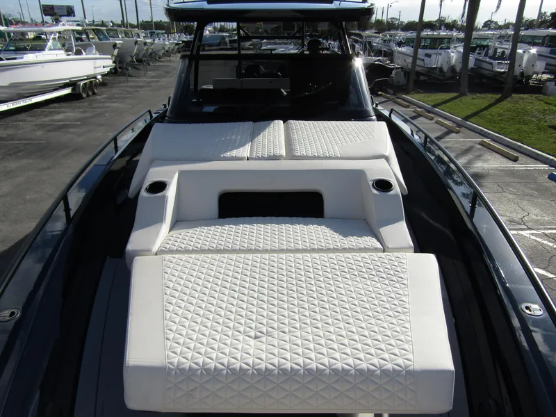 Slide: The Image of 2024 BRABUS Shadow 900 ST luxury boat with quilted seating in a marina. - 9