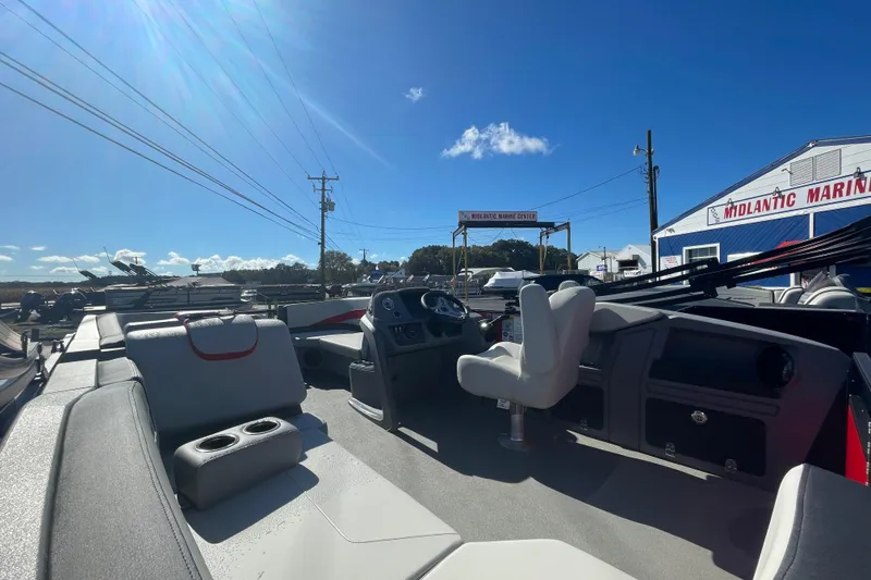 Slide: The Image of 2026 Starcraft GX 18 R boat interior at Midlantic Marine Center under clear blue sky. - 4