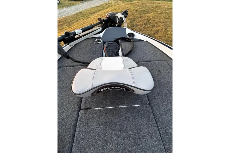 Slide: The Image of 2024 Triton 179 TrX boat deck with seat and trolling motor. - 15