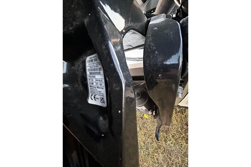 Slide: The Image of 2024 Triton 179 TrX boat engine detail with serial number label. - 21