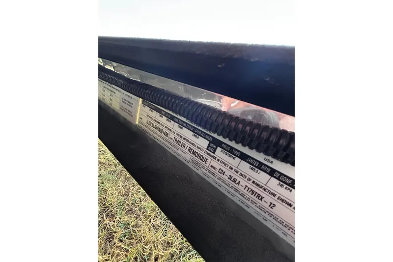 Slide: The Image of 2024 Triton 179 TrX label with specifications and manufacturing details. - 22