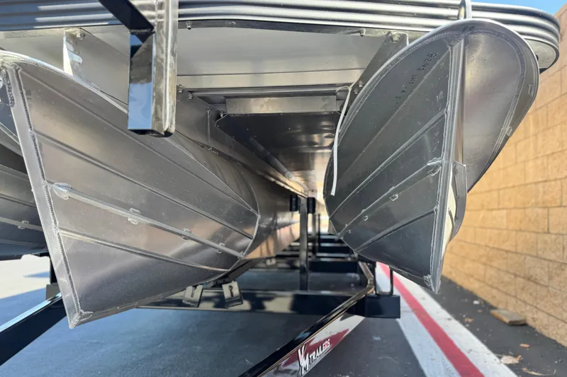Slide: The Image of Underneath view of 2025 Manitou EXPLORE 26 pontoon boat on trailer. - 4
