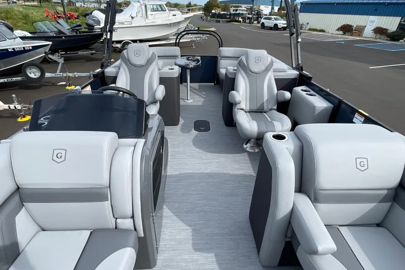 Slide: The Image of 2026 Godfrey Monaco 235 SB pontoon boat with luxurious gray seating and modern design. - 13
