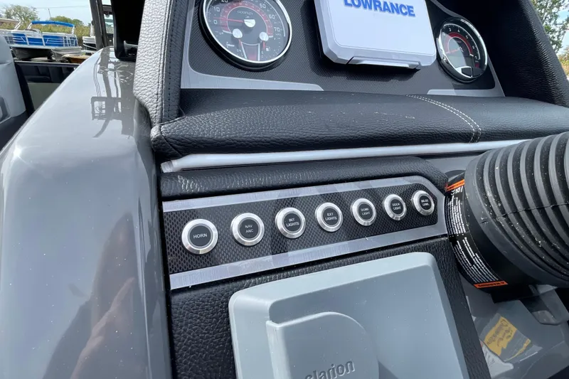 Slide: The Image of Dashboard of 2026 Godfrey Monaco 235 SB boat with control buttons and gauges. - 17