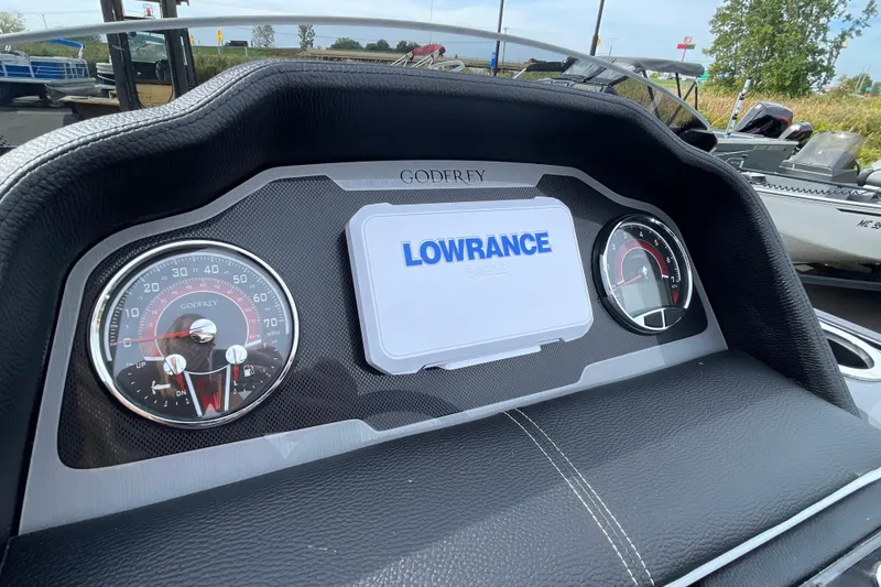 Slide: The Image of Dashboard of 2026 Godfrey Monaco 235 SB with Lowrance display and gauges. - 18