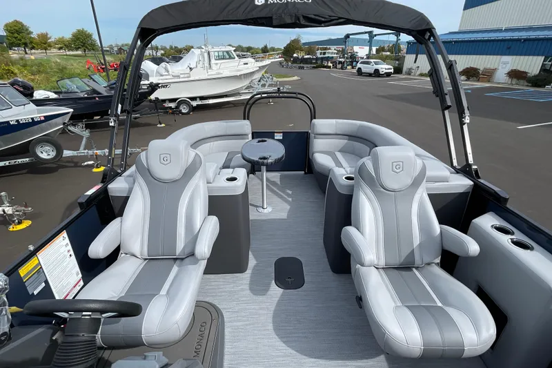 Slide: The Image of 2026 Godfrey Monaco 235 SB pontoon boat with luxurious seating and modern design. - 19