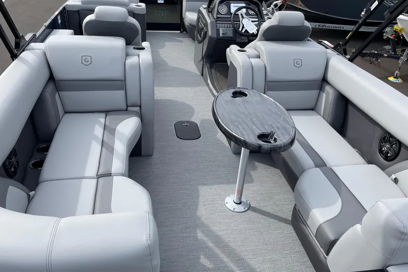 Slide: The Image of Luxurious interior of 2026 Godfrey Monaco 235 SB pontoon boat with plush seating and table. - 21