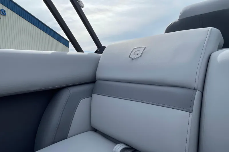Slide: The Image of Luxurious seating on 2026 Godfrey Monaco 235 SB boat, featuring elegant gray upholstery. - 23
