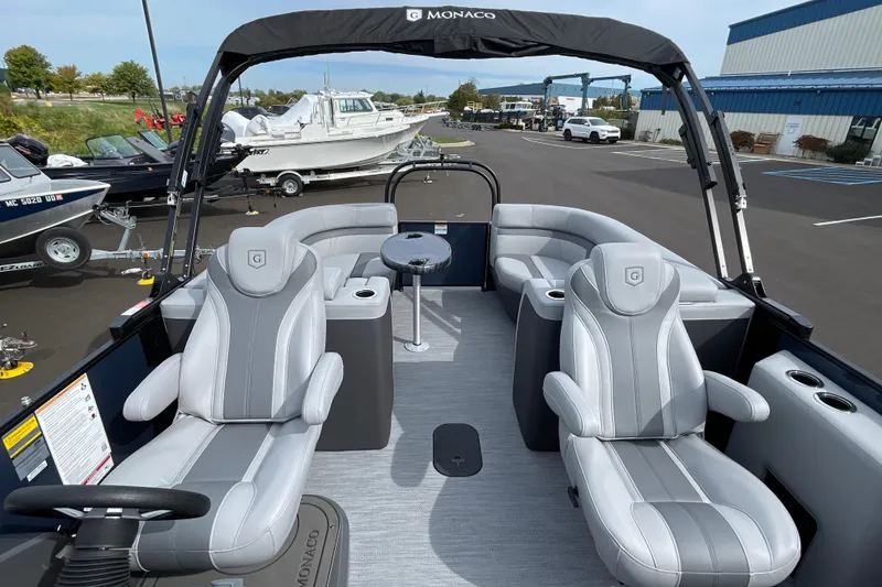 Slide: The Image of 2026 Godfrey Monaco 235 SB pontoon boat interior with luxurious seating and modern design. - 27