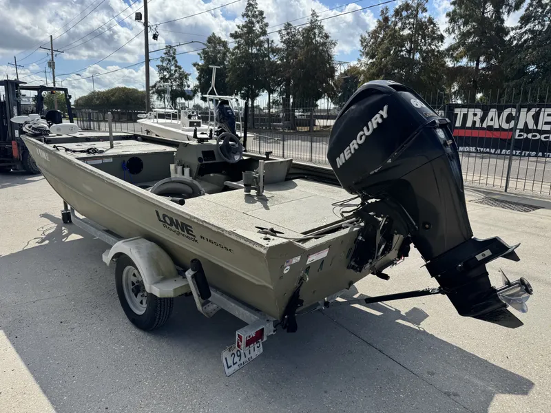 Slide: The Image of 2009 Lowe R1655SC boat with Mercury outboard motor on trailer. - 3