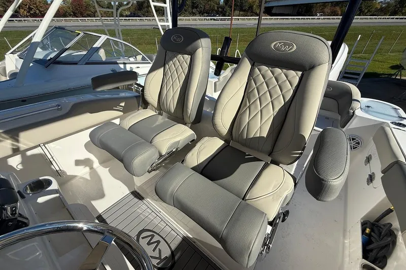 Slide: The Image of 2026 Key West 263 FS boat interior with luxurious seating and steering wheel. - 17