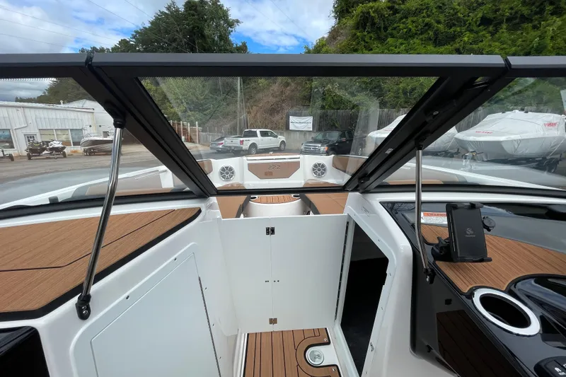 Slide: The Image of Interior view of 2026 Yamaha 222SE boat with sleek design and wood accents. - 18
