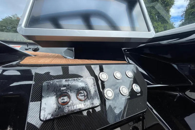 Slide: The Image of Dashboard of 2026 Yamaha 222SE boat with control buttons and display screen. - 19