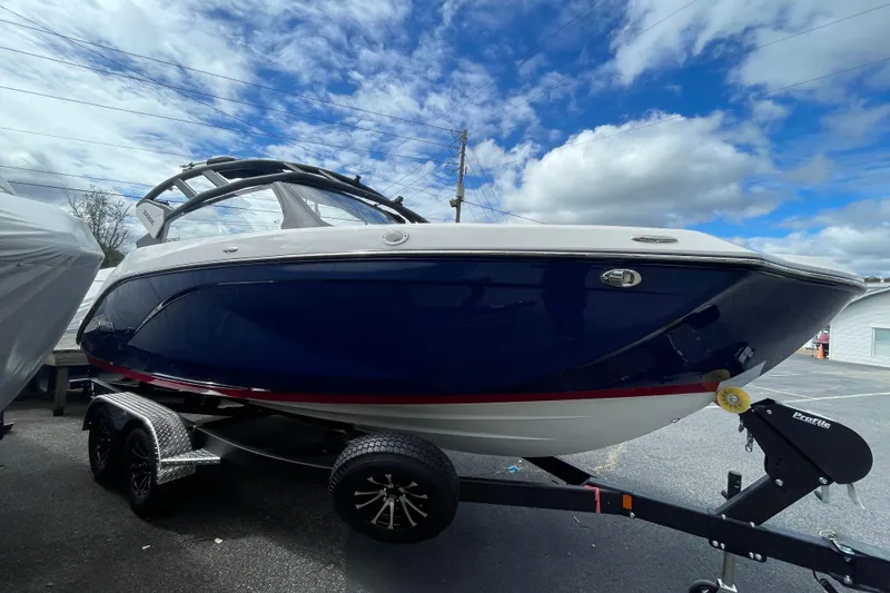 Slide: The Image of 2026 Yamaha 222SE boat on trailer under cloudy sky. - 3