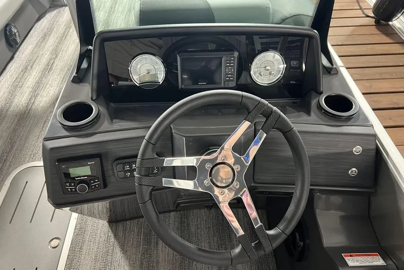 Slide: The Image of 2026 Bennington SSR boat dashboard with steering wheel and modern gauges. - 10