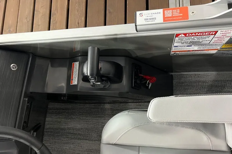 Slide: The Image of Control panel of a 2026 Bennington SSR boat with safety warnings and throttle lever. - 11