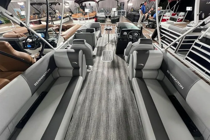 Slide: The Image of 2026 Bennington SSR pontoon boat interior with luxurious seating and modern design. - 13