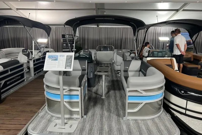 Slide: The Image of 2026 Bennington SSR pontoon boat interior at a showroom display. - 4