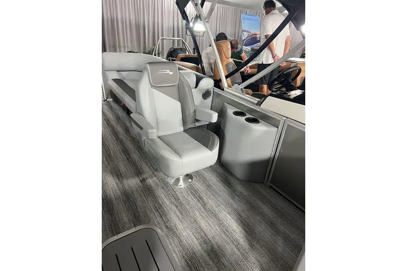 Slide: The Image of 2026 Bennington SSR boat interior with gray seating and modern design. - 8