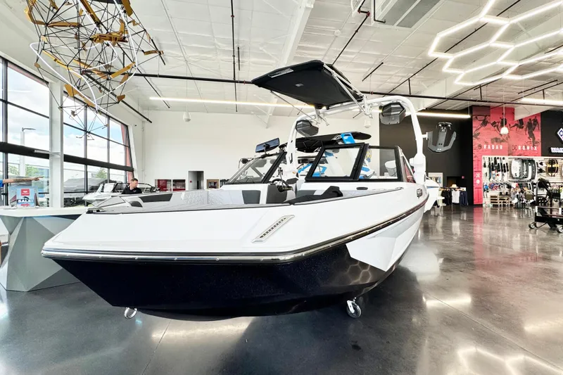 Slide: The Image of 2025 Nautique Super Air Nautique GS20 displayed in a modern showroom. - 3