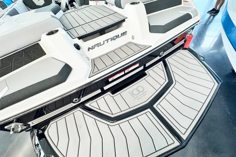 Slide: The Image of 2025 Nautique Super Air Nautique GS20 boat, rear view, Centennial Edition detailing. - 5