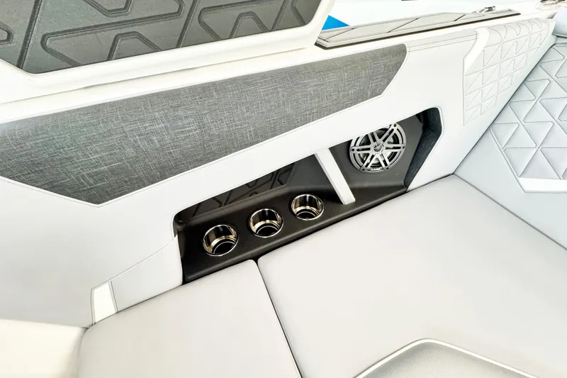 Slide: The Image of 2025 Nautique Super Air Nautique GS20 interior with speaker and cup holders. - 9