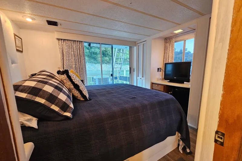 Slide: The Image of Cozy bedroom in 1985 Sumerset 14x60 houseboat with TV and scenic window view. - 20